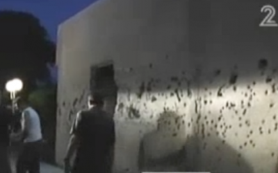 UNIFIL personnel inspect rocket damage at Kibbutz Gesher Haziv on Thursday night (photo credit; Channel 2 screenshot)