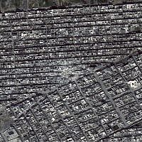 Satellite photo made available by Amnesty International on Wednesday Aug. 7 2013 of the adjoining Ard al-Hamra and Tariq al-Bab districts of Aleppo, Syria following missile strikes in the early evening of February 22, 2013.  (photo credit: AP/ Digital Globe via Amnesty International)