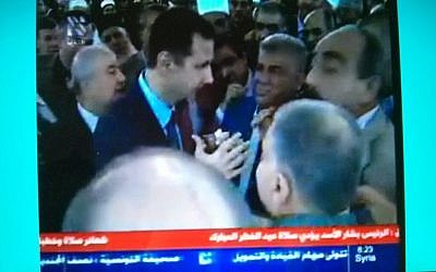 Syrian President Bashar Assad appears on state television shortly after reports of an attack on his presidential convoy Thursday August 8, 2013. (Photo credit: Fernande van Tets/Twitter)