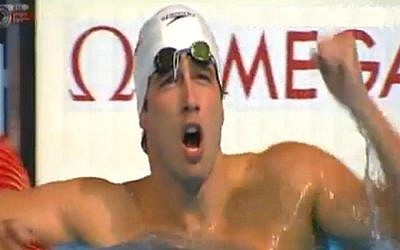 Guy Barnea celebrates in the pool after winning his semifinals heat in the 50 meter backstroke at the World Championships in Barcelona, Saturday, August 4, 2013 (photo credit: Channel 1 screen capture)