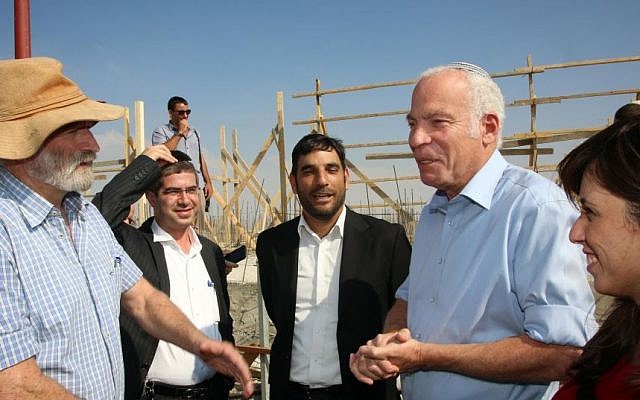 Then housing minister Uri Ariel (second from right) and then deputy transportation minister Tzipi Hotovely (right) during visit to the settlement of Kochav Yaakov in August 2013 (photo credit: Sasson Tiram/ Ministry of Housing and Construction) Then housing minister Uri Ariel (second from right) and then deputy transportation minister Tzipi Hotovely (right) during visit to the settlement of Kochav Yaakov in August 2013 (photo credit: Sasson Tiram/ Ministry of Housing and Construction)