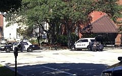 Police assemble outside the YWCA in Manchester, New Hampshire, after Muni Savyon fatally shot his son before fatally shooting himself, on Sunday, August 11, 2013. (photo credit: AP/WMUR-TV, Nick Spinetto)