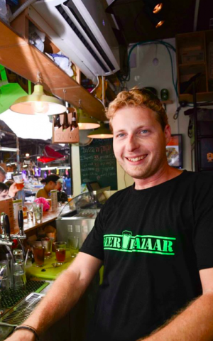 Yuval happily pours beer all day, every day (Courtesy Beer Bazaar)