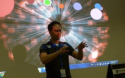 A member of the team demonstrating Hand Your Music, the app that won the Intel Israel Perceptual Computing Hackathon. (photo credit: Courtesy)