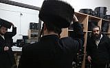 Illustrative photo of a man trying on a shtreimel in the ultra-Orthodox neighborhood of Mea Shearim, Jerusalem. (photo credit: Nati Shohat/Flash90)
