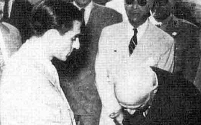 Prime minister Mohammad Mossadegh shaking hands with Mohammad Reza Schah Pahlavi in 1951. (Wikipedia)