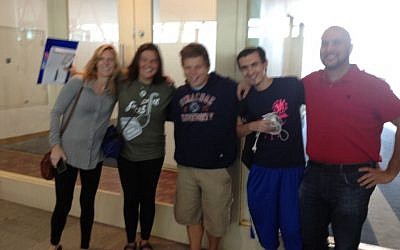 From left, mother Amy Nelson, immigrant Stephanie Closter, boyfriend David Strinkofsky, brother Matthew Nelson and father David Nelson before the flight. (photo credit:Joshua Davidovich)
