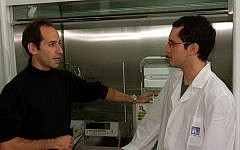 Dr. Ernesto Joselevich (left) and a student near carbon nanotube synthesis reactor (photo credit: Weizmann Institute)
