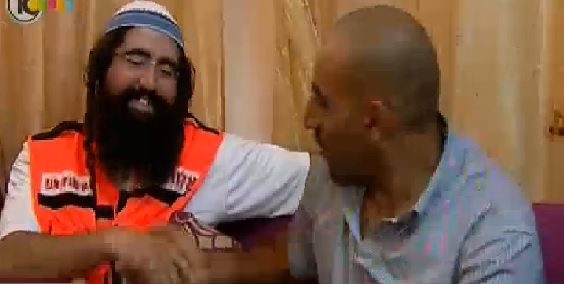 Attias and Azloni together in Azloni's home in the Muslim Quarter of Jerusalem's Old City (photo credit: Channel 10 News screen cap) Attias and Azloni together in Azloni's home in the Muslim Quarter of Jerusalem's Old City (photo credit: Channel 10 News screen cap)