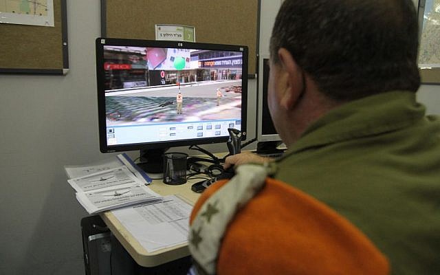 A battalion commander in the IDF Home Front Command uses a simulator during a recent drill (photo credit: Courtesy: IDF Spokesperson's Office) A battalion commander in the IDF Home Front Command uses a simulator during a recent drill (photo credit: Courtesy: IDF Spokesperson's Office)