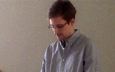 NSA leaker Edward Snowden during his meeting with Russian activists and officials at Sheremetyevo airport, Moscow, Russia, on July 12, 2013 (photo credit: AP/Tatyana Lokshina/Human Rights Watch)