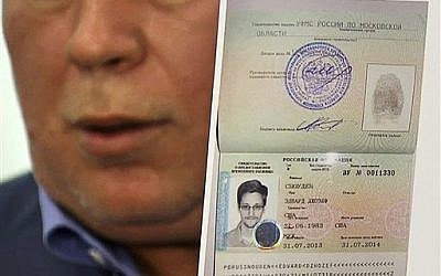 Russian lawyer Anatoly Kucherena showing a temporary document to allow National Security Agency leaker Edward Snowden into Russia. Moscow, August 1, 2013 (AP Photo/Associated Press Television)