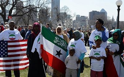 Illustrative photo of Somali-Americans holding American and Somaliland flags (photo credit: CC BY Fibonacci Blue, Flickr)