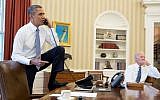 Barack Obama speaking to House Speaker John Boehner from the Oval Office Saturday as Joe Biden looks on. (photo credit: Pete Souza/ Official White House)