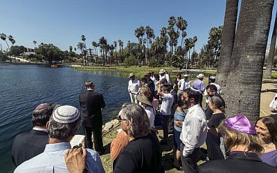 Illustrative: Los Angeles Temple Knesset Israel community members gather on the first day of Rosh Hashanah to recite the Tashlich prayer. (AP Photo/Damian Dovarganes)