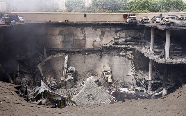 This photo released by the Kenya Presidency shows the collapsed upper car park of the Westgate Mall in Nairobi, Kenya Thursday, September 26, 2013. Working near bodies crushed by rubble in a bullet-scarred, scorched mall, FBI agents continued fingerprint, DNA and ballistic analysis to help determine the identities and nationalities of victims and al-Shabab gunmen who attacked the shopping center, killing more than 60 people. (photo credit: AP Photo/Kenya Presidency)