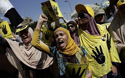 Protesters in Cairo, Egypt, on Friday (photo credit: AP/Hassan Ammar)