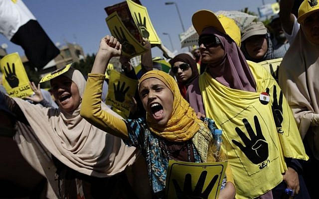 Protesters in Cairo, Egypt, on Friday (photo credit: AP/Hassan Ammar) Protesters in Cairo, Egypt, on Friday (photo credit: AP/Hassan Ammar)