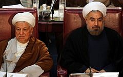 Hassan Rouhani (right) and Akbar Hashemi Rafsanjani during a session of Assembly of Experts in Tehran, September 2013. (AP)