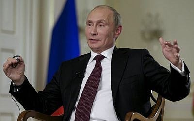Russian President Vladimir Putin gives an interview earlier this month, ahead of the G-20 conference (photo credit: AP/Alexander Zemlianichenko)