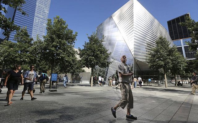 A visitor to the National September 11 Memorial and Museum takes in the sight as he walks past the museum, Friday, Sept. 6, 2013 in New York. (photo credit: AP Photo/Mary Altaffer)