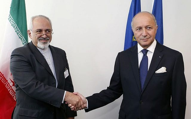 Iranian Foreign Minister Mohammad Javad Zarif, left, and French Foreign Minister Laurent Fabius shake hands before conducting a bilateral meeting during the 68th session of the United Nations General Assembly at UN headquarters, Wednesday, September 25, 2013. (photo credit: AP/Jason DeCrow) Iranian Foreign Minister Mohammad Javad Zarif, left, and French Foreign Minister Laurent Fabius shake hands before conducting a bilateral meeting during the 68th session of the United Nations General Assembly at UN headquarters, Wednesday, September 25, 2013. (photo credit: AP/Jason DeCrow)
