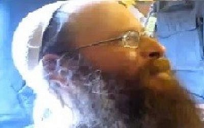 Right-wing activist Boaz Albert in his House in Yitzhar, (photo credit: YouTube screenshot)