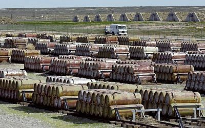 This 2001 file photo shows a safety vehicle passing a compound filled with 170-gallon containers of mustard and blister agent at the Deseret Chemical Depot in Tooele, Utah. (photo credit: AP/Douglas C. Pizac/File)