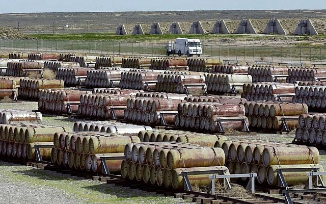 This 2001 file photo shows a safety vehicle passing a compound filled with 170-gallon containers of mustard and blister agent at the Deseret Chemical Depot in Tooele, Utah. (photo credit: AP/Douglas C. Pizac/File)