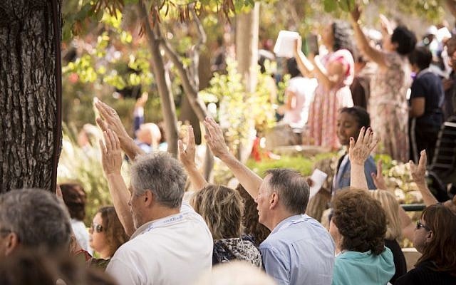 Participants in the Feast of Tabernacles pray at the Garden Tomb in Jerusalem, this week (Courtesy of the International Christian Embassy Jerusalem)