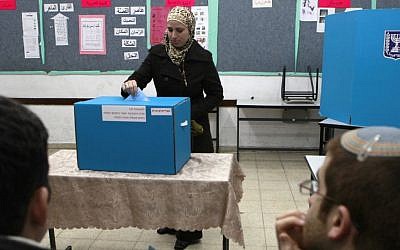An Arab woman casts her vote in the Jerusalem suburb of Abu Ghosh, 2009 (photo credit: Flash90/Nati Shohat)