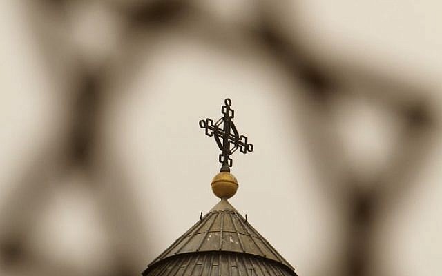 Illustrative photo of a cross seen through a Star of David in the Old City of Jerusalem. (photo credit: Miriam Alster/Flash90) Illustrative photo of a cross seen through a Star of David in the Old City of Jerusalem. (photo credit: Miriam Alster/Flash90)