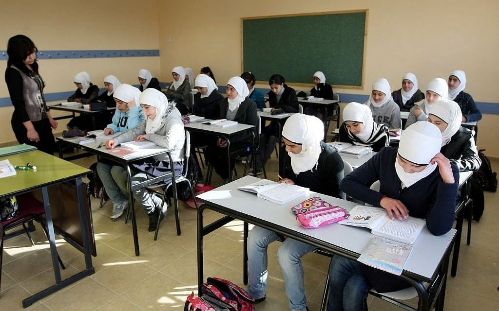 Young Arab students in class at an elementary school in the Arab neighborhood of Umm Tuba in East Jerusalem, December 13, 2011 (Flash90/Kobi Gideon) Young Arab students in class at an elementary school in the Arab neighborhood of Umm Tuba in East Jerusalem, December 13, 2011 (Flash90/Kobi Gideon)