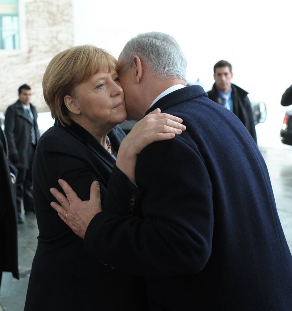 Chancellor Angela Merkel and Prime Minister Benjamin Netanyahu embrace after attending a joint press conference in Berlin, Germany on December 06, 2012. (photo credit: Amos Ben Gershom/GPO/Flash90) Chancellor Angela Merkel and Prime Minister Benjamin Netanyahu embrace after attending a joint press conference in Berlin, Germany on December 06, 2012. (photo credit: Amos Ben Gershom/GPO/Flash90)
