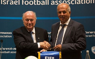 FIFA President Sepp Blatter (left) with former Israel Football Association chairman Avi Luzon during Blatter's visit to Israel in July, 2013. (photo credit: Yonatan Sindel/Flash90)