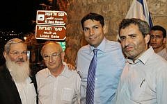 Deputy ministers Eli Ben Dahan (left), Danny Danon (second right), Ze'ev Elkin (right) and former MK Aryeh Eldad outside Lion's Gate after participating a march on the eve of Tisha B'av, around the city walls of Jerusalem's Old City, July 15, 2013. (photo credit: Gershon Elinson/Flash90)