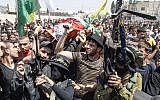 Palestinian mourners carry the body of Majd Lahluh during his funeral at Jenin refugee camp in Jenin on August 20, 2013. Israeli troops shot the Palestinian youth and wounded two others during an arrest operation in the city, the army said. (Photo credit: Issam Rimawi/Flash90)