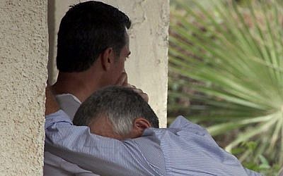 Relatives seen near the house of murdered IDF soldier Tomer Hazan in the coastal city of Bat Yam in central Israel on September 21, 2013. (photo credit: Gideon Markowicz/Flash90)