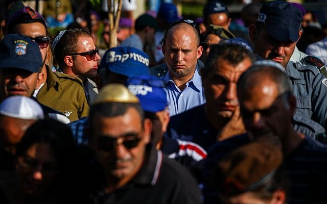 Economy Minister Naftali Bennett (in blue shirt) seen during the funeral of of Israeli soldier Staff Sergeant Gal Gabriel Kobi, 20, in the Haifa military cemetery, on September 23, 2013. (photo credit: Avishag Shaar Yashuv/FLASH90) Economy Minister Naftali Bennett (in blue shirt) seen during the funeral of of Israeli soldier Staff Sergeant Gal Gabriel Kobi, 20, in the Haifa military cemetery, on September 23, 2013. (photo credit: Avishag Shaar Yashuv/FLASH90)