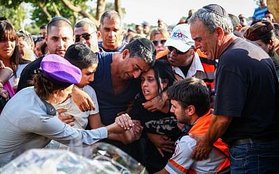 The family of Israeli soldier Staff Sergeant Gal Gabriel Kobi, 20, seen during his funeral in the Haifa military cemetery, on September 23, 2013 (Photo credit: Avishag Shaar Yashuv/FLASH90)