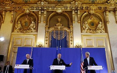 John Kerry, right, and William Hague, left, listen to French Foreign Minister Laurent Fabius speak at a news conference after a meeting on Syria, at the Quai d'Orsay in Paris, Monday, September 16, 2003. (photo credit: AP/Larry Downing, Pool)