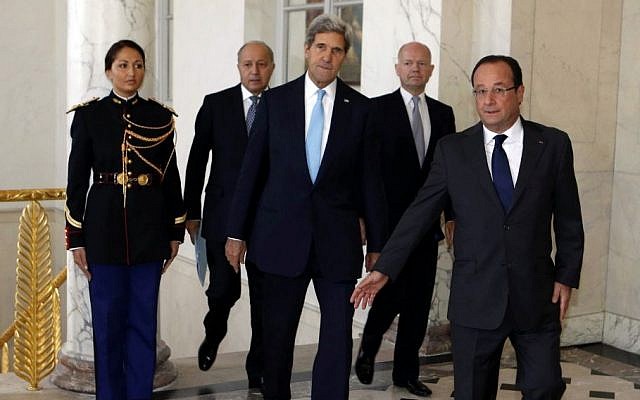 U.S. Secretary of State John Kerry, center, walks with French President Francois Hollande, right, French Foreign Minister Laurent Fabius, second left, and British Foreign Secretary William Hague, second right, before a meeting regarding Syria, at the Elysee presidential palace in Paris, Monday, Sept. 16, 2013 (photo credit: AP/Larry Downing) U.S. Secretary of State John Kerry, center, walks with French President Francois Hollande, right, French Foreign Minister Laurent Fabius, second left, and British Foreign Secretary William Hague, second right, before a meeting regarding Syria, at the Elysee presidential palace in Paris, Monday, Sept. 16, 2013 (photo credit: AP/Larry Downing)