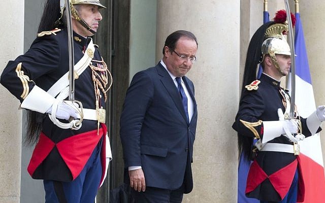 French President Francois Hollande walks out of the lobby of the Elysee Palace, on Syria, Paris, on Friday, September 13, 2013. (photo credit: AP/Michel Euler) French President Francois Hollande walks out of the lobby of the Elysee Palace, on Syria, Paris, on Friday, September 13, 2013. (photo credit: AP/Michel Euler)