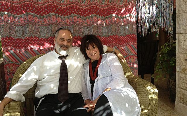 Shimon and Cheryl Matthews in their sukkah-extended home (photo credit: Jessica Steinberg/Times of Israel)