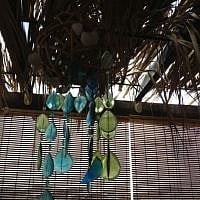 A master of recycling crafts, Cheryl Matthews strung pieces of her daughter's beaded curtain around wicker balls for a Sukkah decoration (Jessica Steinberg/Times of Israel)