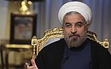 In this Sept. 10, 2013 photo released by the official website of the office of the Iranian Presidency, Iranian President Hasan Rouhani speaks during an interview with state television at the presidency in Tehran, Iran. (Photo credit: AP/Presidency Office, Rouzbeh Jadidoleslam)