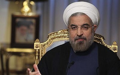 In this Sept. 10, 2013 photo released by the official website of the office of the Iranian Presidency, Iranian President Hasan Rouhani speaks during an interview with state television at the presidency in Tehran, Iran. (Photo credit: AP/Presidency Office, Rouzbeh Jadidoleslam)