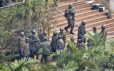 Soldiers from the Kenyan Defense Forces gather at the entrance to the Westgate Mall in Nairobi, Kenya Thursday, September 26, 2013. Working near bodies crushed by rubble in a bullet-scarred, scorched mall, FBI agents began fingerprint, DNA and ballistic analysis Wednesday to help determine the identities and nationalities of victims and al-Shabab gunmen who attacked the shopping center, killing more than 60 people. (photo credit: AP Photo/Ben Curtis) Soldiers from the Kenyan Defense Forces gather at the entrance to the Westgate Mall in Nairobi, Kenya Thursday, September 26, 2013. Working near bodies crushed by rubble in a bullet-scarred, scorched mall, FBI agents began fingerprint, DNA and ballistic analysis Wednesday to help determine the identities and nationalities of victims and al-Shabab gunmen who attacked the shopping center, killing more than 60 people. (photo credit: AP Photo/Ben Curtis)