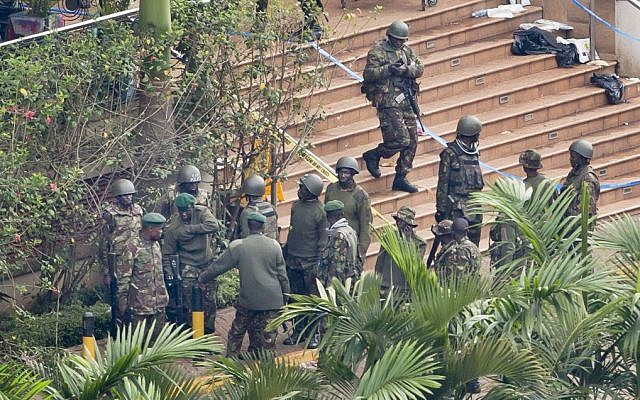 Soldiers from the Kenyan Defense Forces gather at the entrance to the Westgate Mall in Nairobi, Kenya Thursday, September 26, 2013. (photo credit: AP Photo/Ben Curtis)