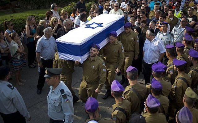 Israeli soldiers carry the flagged wrapped coffin of Staff Sergeant Gabriel Koby, during his funeral at the military cemetery in Haifa ,Israel, Monday, Sept. 23, 2013. (Photo credit: AP/Ariel Schalit) Israeli soldiers carry the flagged wrapped coffin of Staff Sergeant Gabriel Koby, during his funeral at the military cemetery in Haifa ,Israel, Monday, Sept. 23, 2013. (Photo credit: AP/Ariel Schalit)